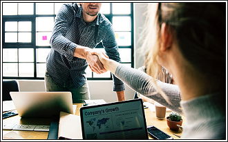 IT Support Tech shaking hands with a customer